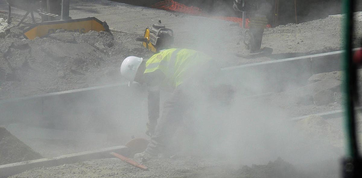 How can construction dust cause allergies?